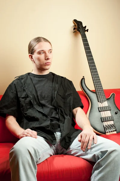 Portrait of musician with bass guitar — Stock Photo, Image