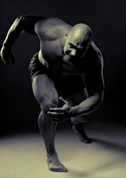 Muscular man running — Stock Photo, Image