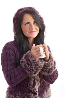 A young woman in a sweater isolated on white