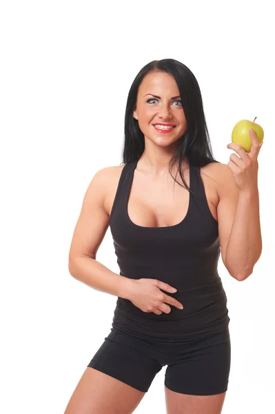 Fitness tjej med grönt äpple isolerad på vit — Stockfoto