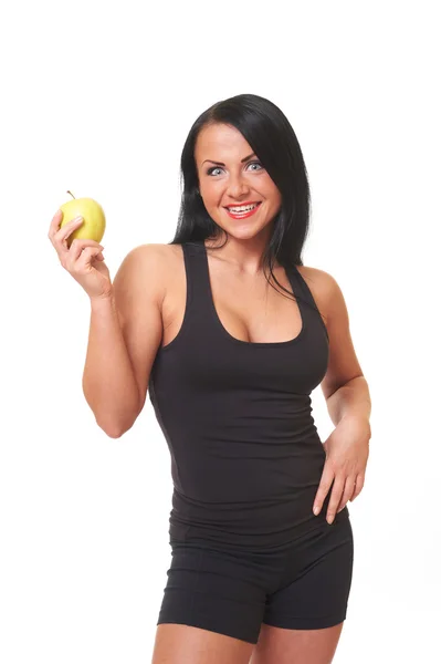 Фитнес-девушка с зеленым яблоком изолированы на белом — стоковое фото
