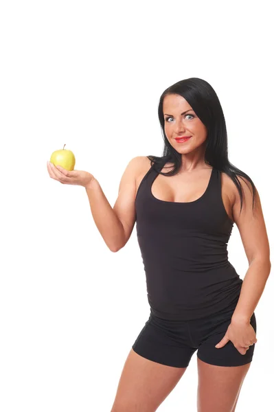 Fitness tjej med grönt äpple isolerad på vit — Stockfoto