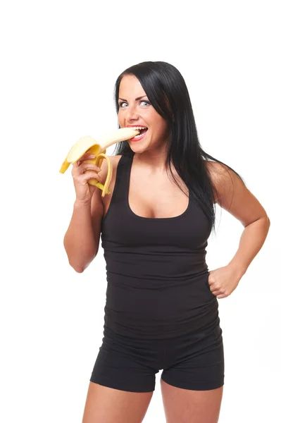 Fitness ragazza con banana isolata su bianco — Foto Stock