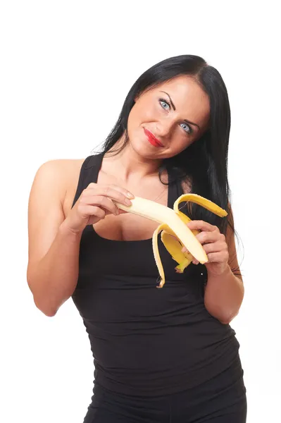 Девушку с бананом изолировали на белом — стоковое фото