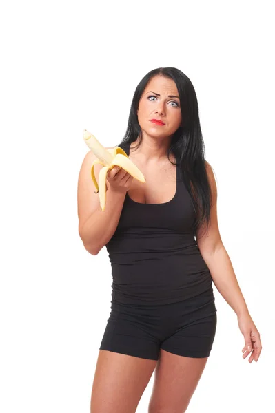 Fitness girl with banana isolated on white — Stock Photo, Image