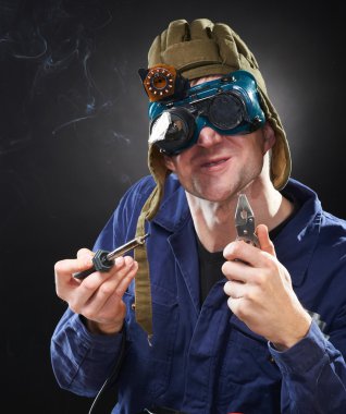 Crazy genious witth soldering iron clipart