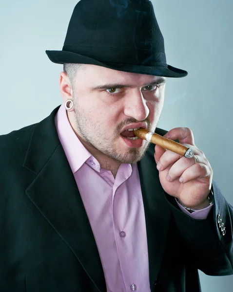 Man with cigar in hat — Stock Photo, Image