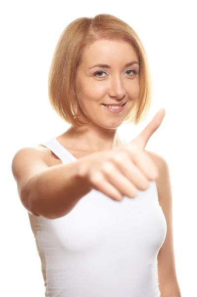 Молодая женщина на белом, показывающая большие пальцы вверх — стоковое фото