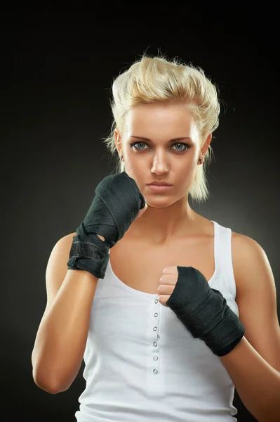Beautiful boxer girl with black bandage on hands — Stock Photo, Image