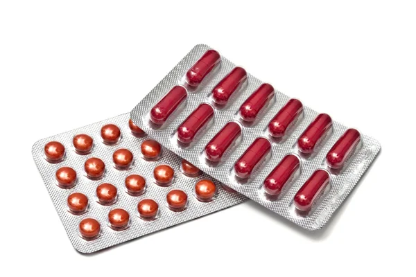 赤い錠剤とカプセル — ストック写真