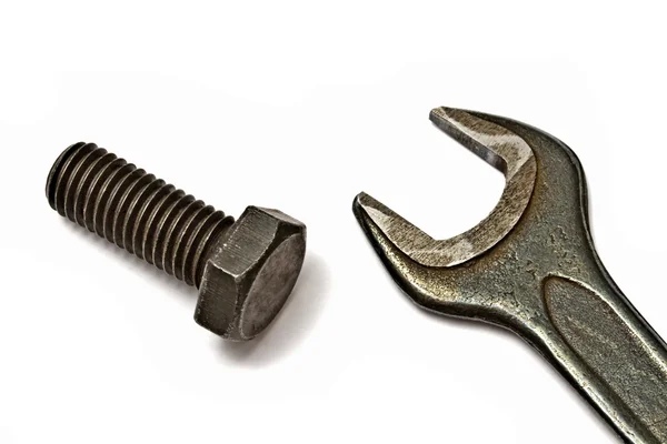 Старый ключ и болт — стоковое фото