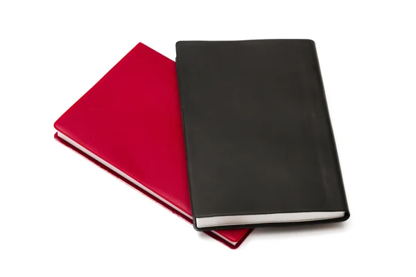 孤立在白色背景上的红色和黑色笔记本 — 图库照片