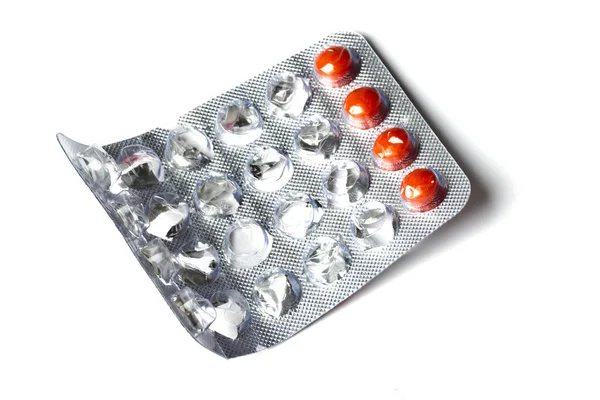 白い背景で隔離赤い丸薬 — ストック写真