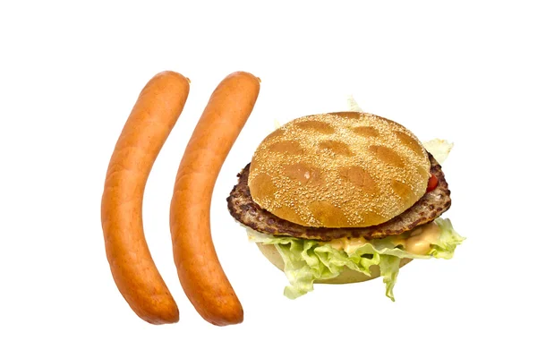 Delicious hamburger and sausages — Stock Photo, Image