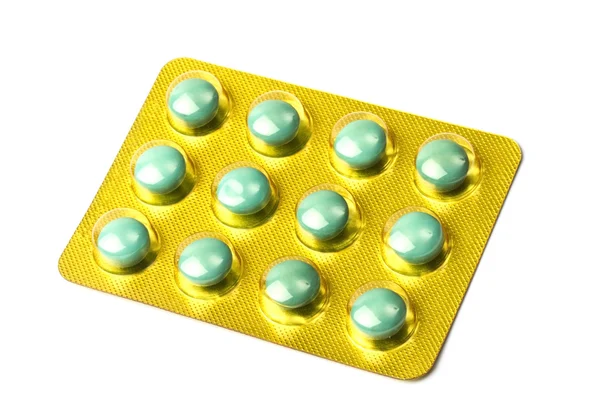 Πακέτο πράσινα χάπια που απομονώνονται σε λευκό — Φωτογραφία Αρχείου