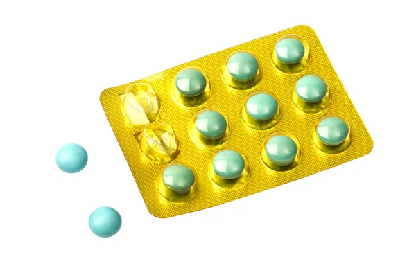 Set di pillole verdi isolate su bianco — Foto Stock