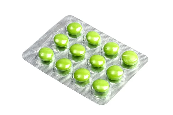 Package of green pills isolated on white — Stock Photo, Image