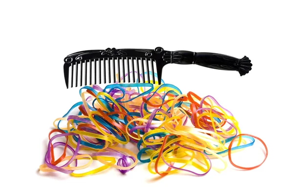 Colorful rubber bands and comb — Stock Photo, Image