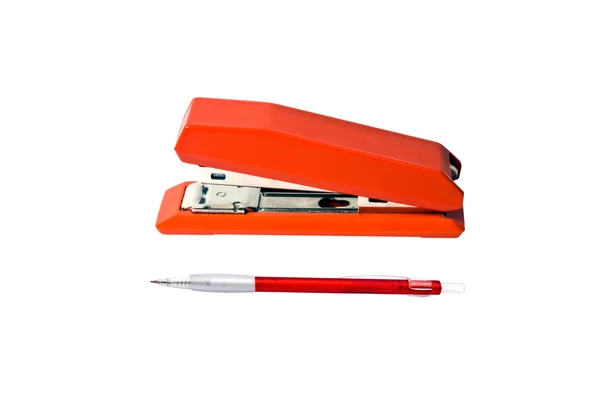 Grampeador vermelho e caneta — Fotografia de Stock
