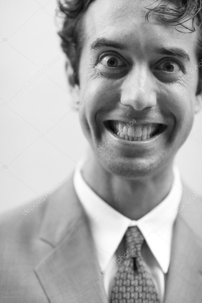 Businessman with a crazy smile