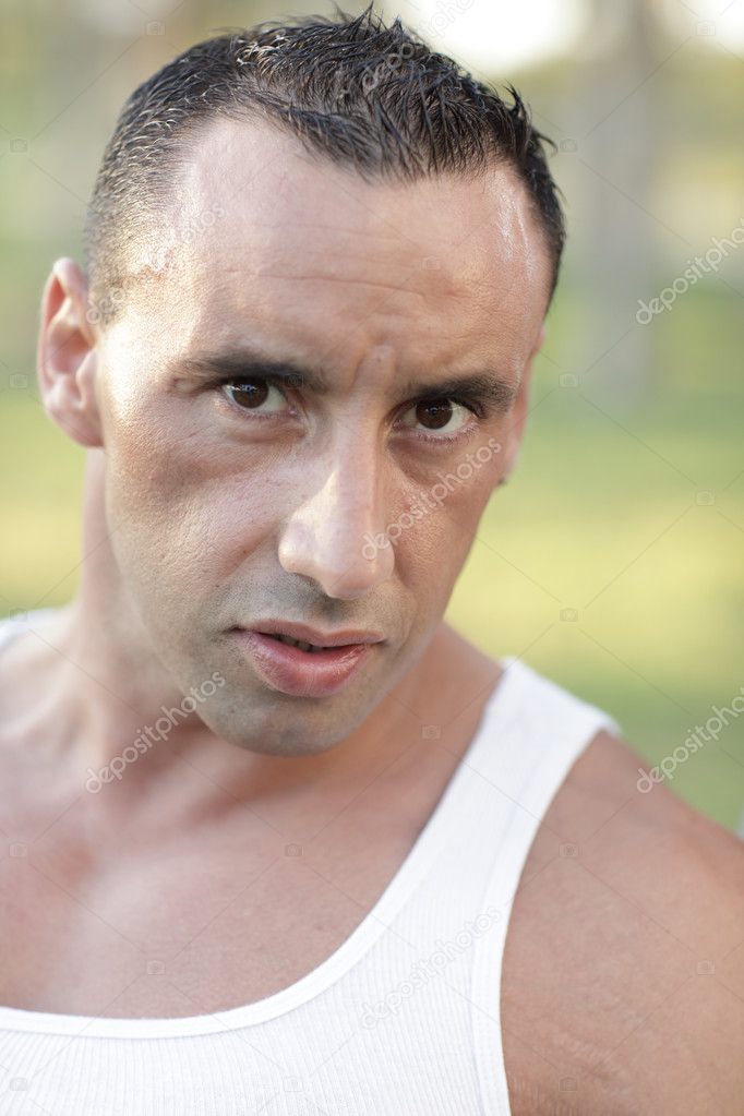 Headshot of a tough guy in the park