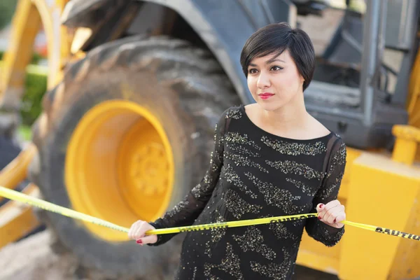 stock image Image of a woman posing by construction equipment