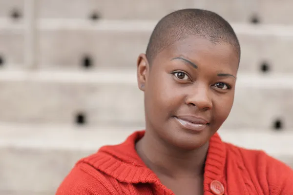 Headshot of a bald black woman — Stock Photo, Image
