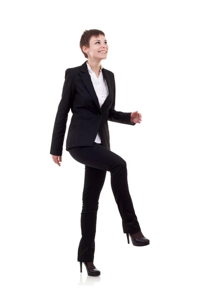 Woman stepping on imaginary step — Stock Photo, Image