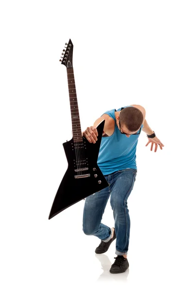 Estrela de rock segurando uma guitarra elétrica — Fotografia de Stock