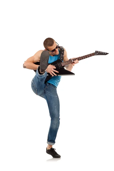 Пинающий гитарист — стоковое фото