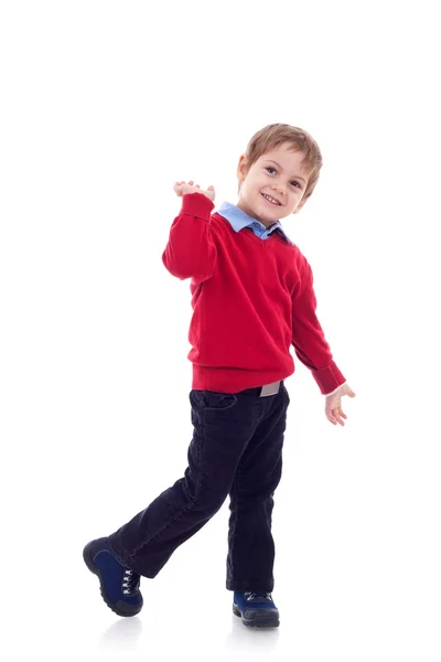 Улыбающийся мальчик в джинсах — стоковое фото