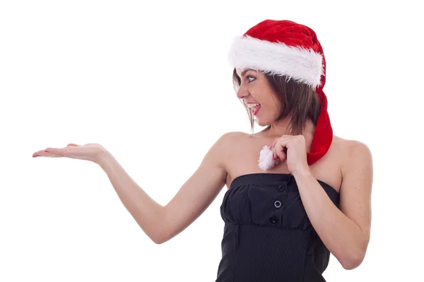 Frau mit Weihnachtsmannmütze hält etwas — Stockfoto