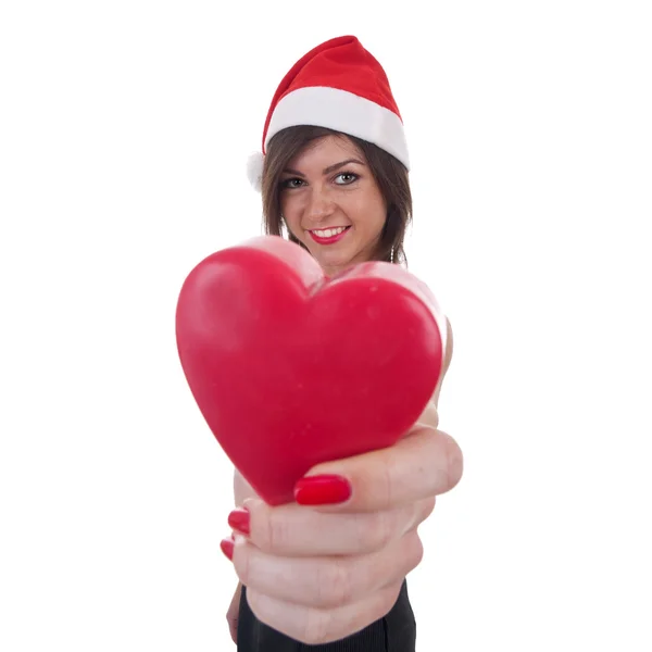 Noel Baba şapkası kalp tutan kadın — Stok fotoğraf