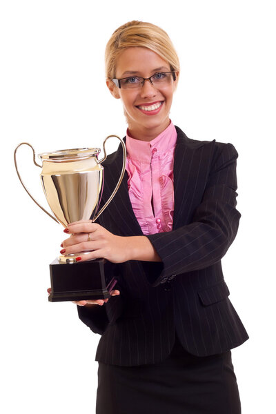 Happy business woman holding a trophy in her hand, isolated