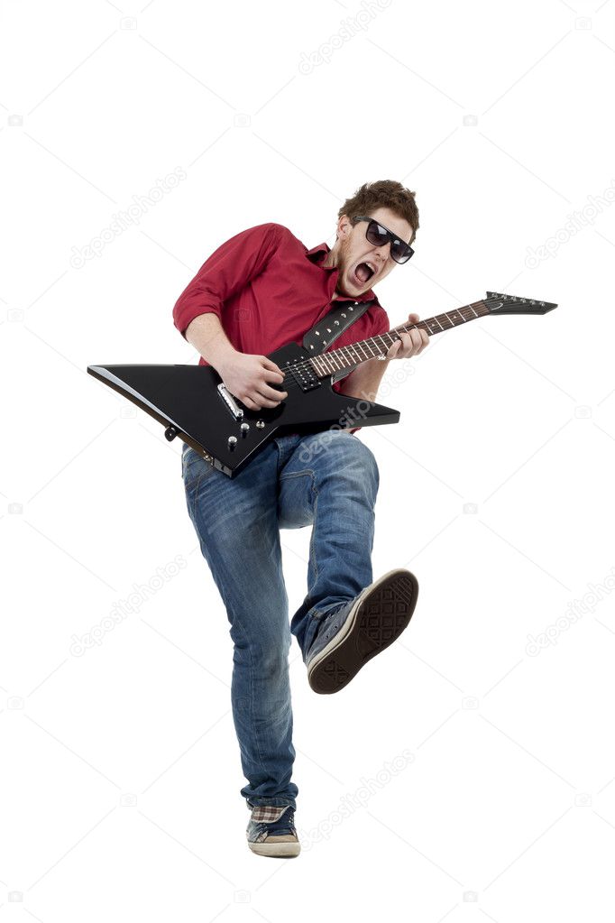 Passionate musician with sunglasses playing the guitar, isolated