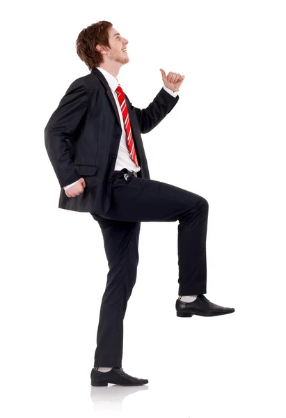 Šťastný Obchodní Muž Lezení Přes Bílé Backgroung — Stock fotografie