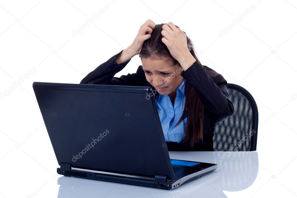 Business woman reading bad news at laptop