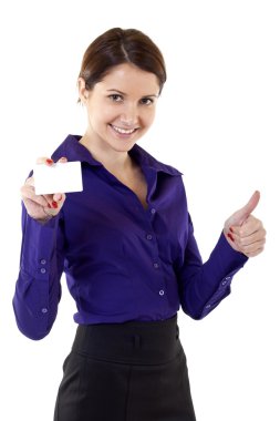 Portrait of young pretty woman holding blank business card giving thumbs up isolated on white background clipart