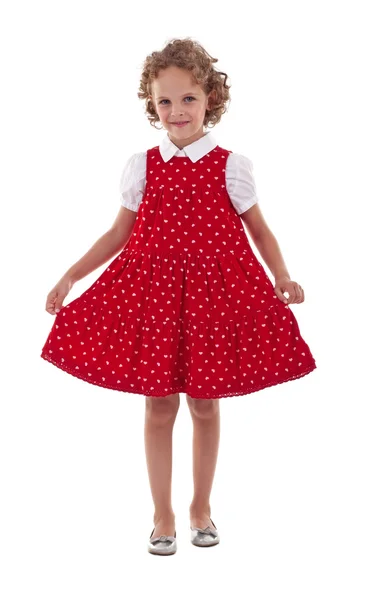Szép, mosolygós, piros ruhás kislány — Stock Fotó