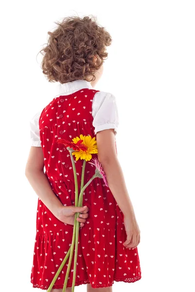 Achterkant van meisje verbergen bloemen voor Moederdag — Stockfoto