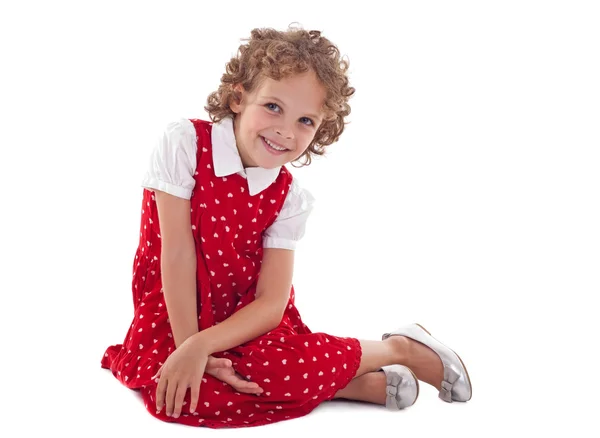 Красива маленька дівчинка сидить — стокове фото