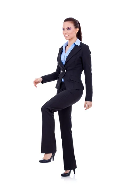 Mujer de negocios pisando paso imaginario —  Fotos de Stock