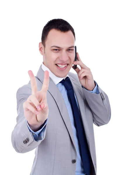 Mann macht Siegeszeichen am Telefon — Stockfoto