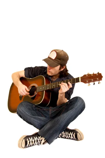Gitarzysta siedzi — Zdjęcie stockowe