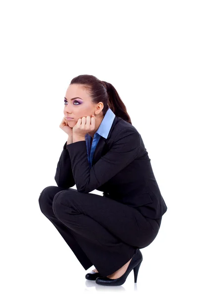 Woman standing down and thinking Royalty Free Stock Images