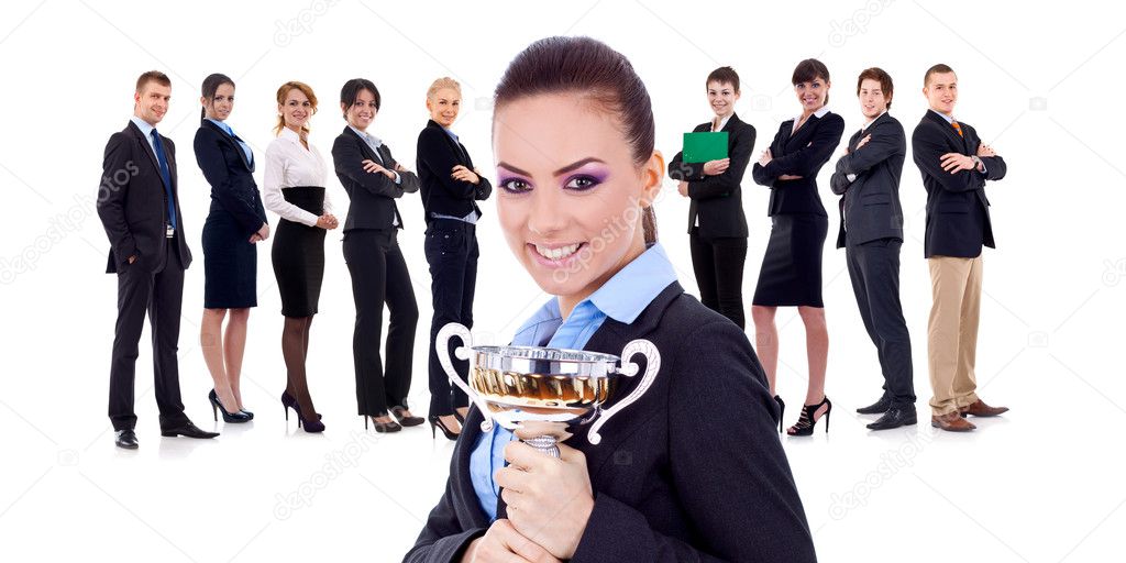 Winning businessteam, female holding trophy