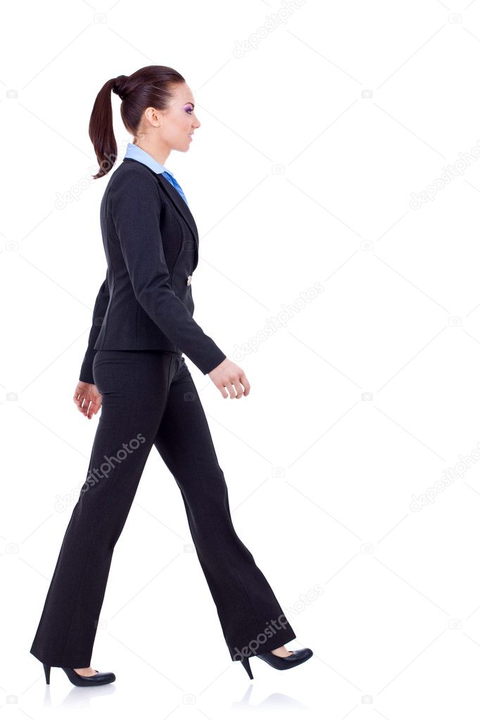 Young business woman is walking