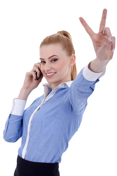 Businesswoman with phone and victory gesture — Stock Photo, Image