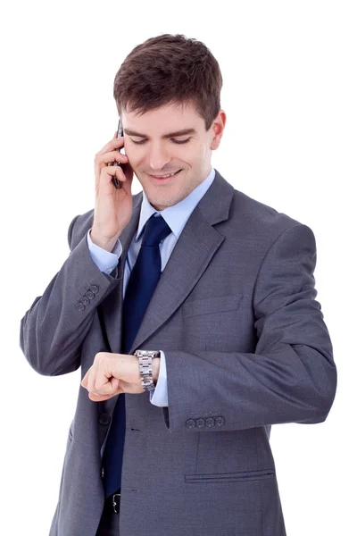 Muž kontrola času během řeči na mobil — Stock fotografie