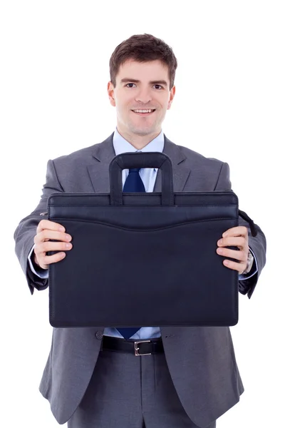 Business man offering a black briefcase — Stock Photo, Image